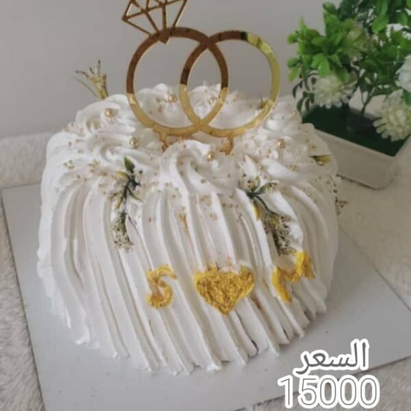 💍 تورتة "رباط الحب" – فخامة اللون الأبيض والذهب لمناسبتكم الملكية ✨